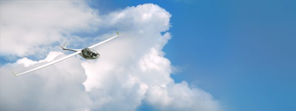 Segelflugzeug Volito fliegend vor weissen Wolken